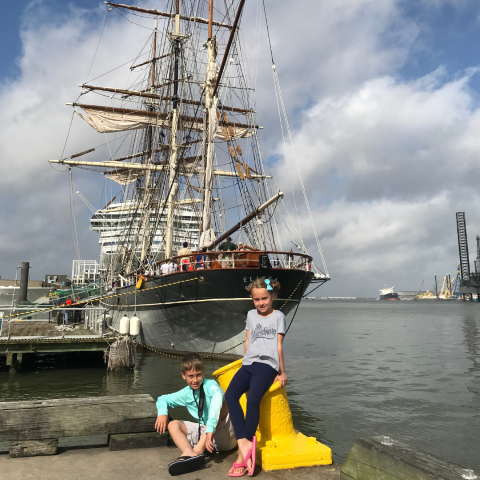 homeschool students in front of the tall elissa ship in galveston